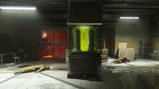 A green chamber containing Nebula V in the middle of a dark room with two dead soldiers on the ground